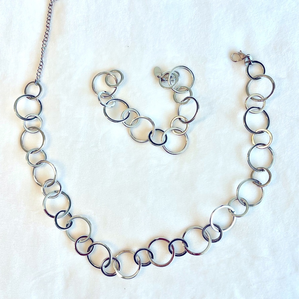 Silver ringed necklace with matching bracelet.